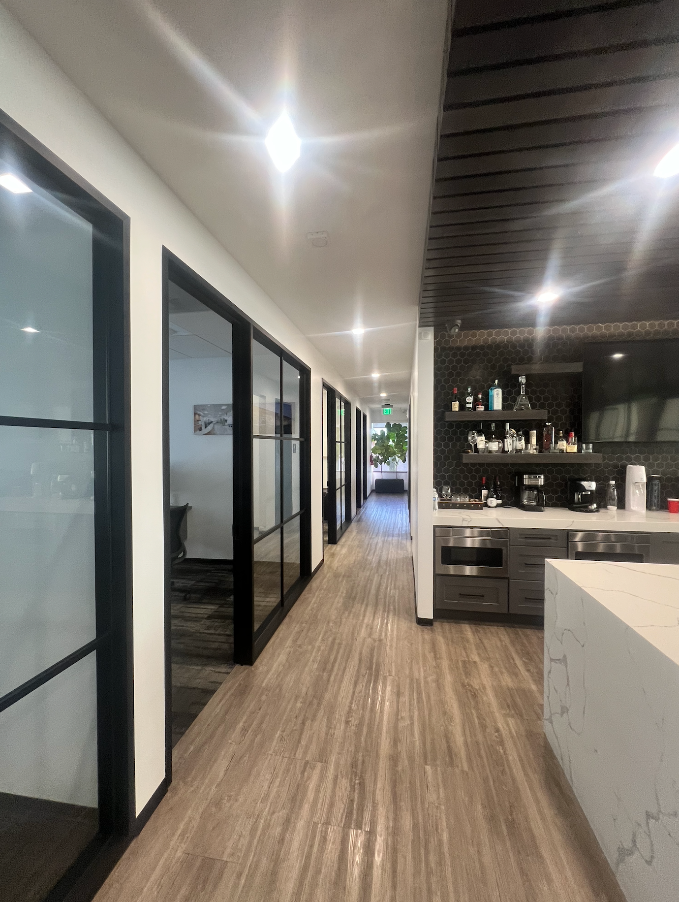 Executive office corridor and open workspace